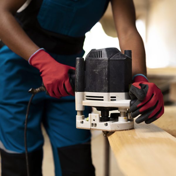 carpenter-cutting-mdf-board-inside-workshop