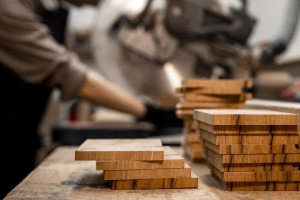 side-view-female-carpenter-studio-using-electric-saw